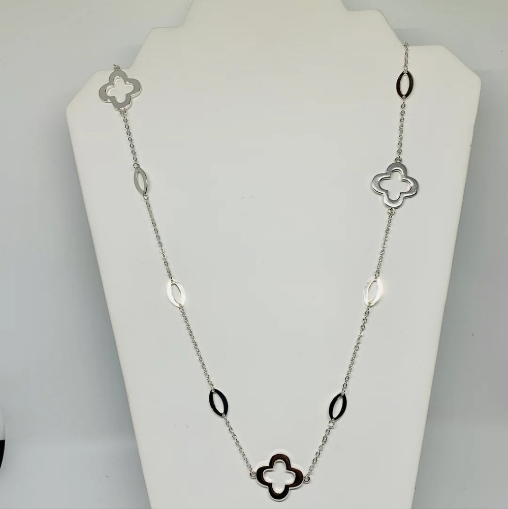 Elegant Silver Necklace with Clover Accents